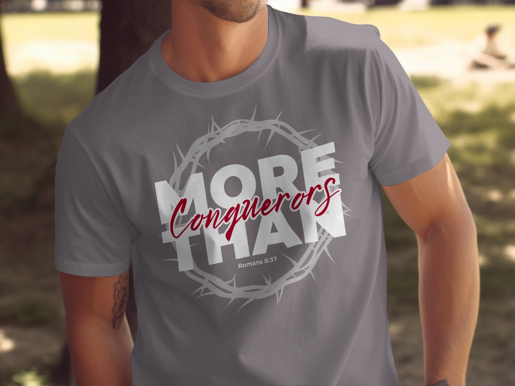 More Than Conquerors Romans 8:37 Graphic Tee
